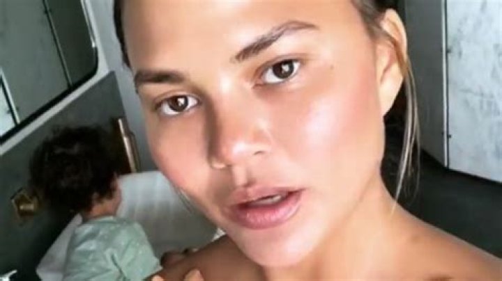 Chrissy Teigen Flaunts ‘Freaky’ Skin-Implanted Feathers & Fans Freak On Twitter — Pics